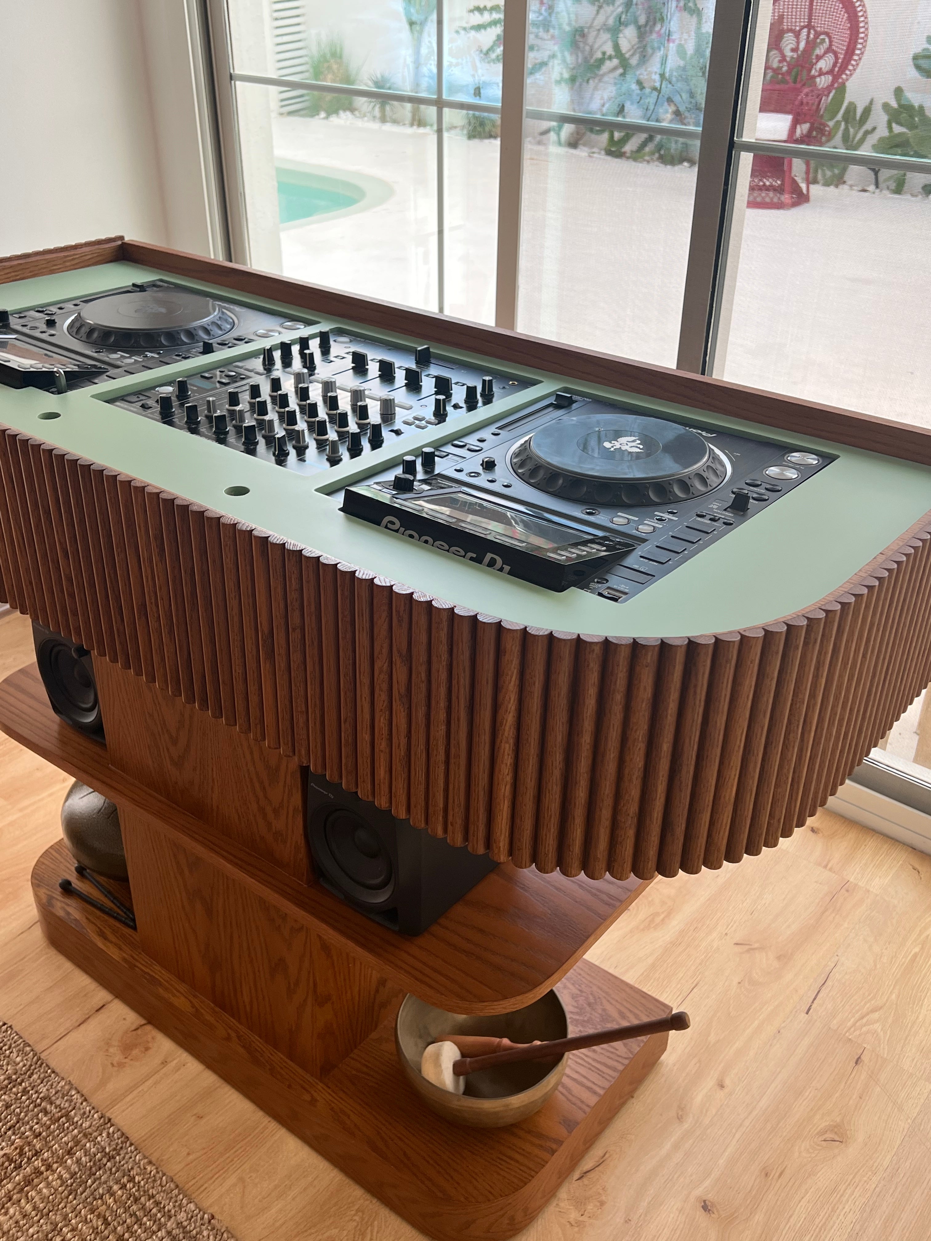 DJ setup with turntables and speakers